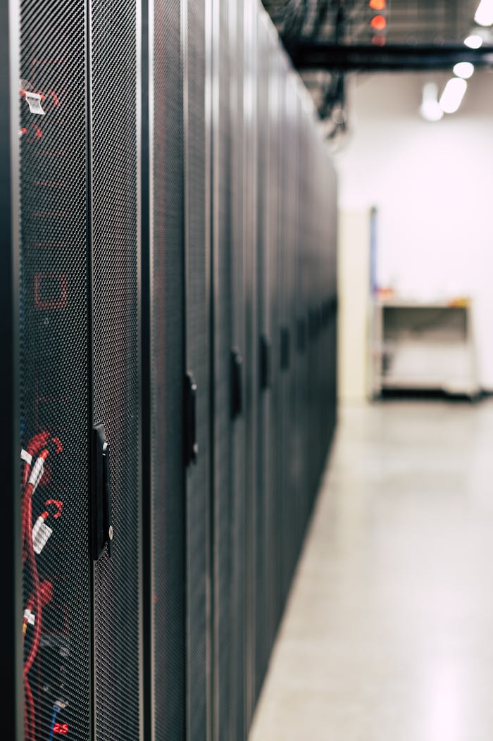 High-tech data center featuring multiple server racks with advanced equipment.